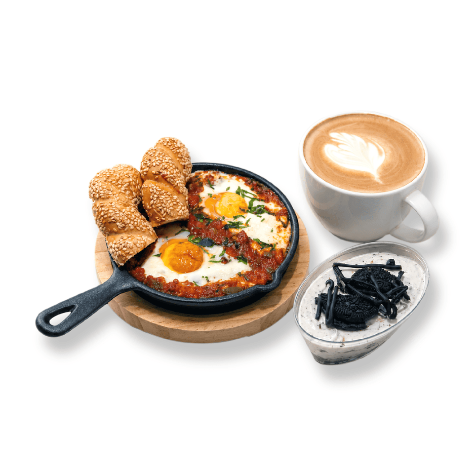 Bullseye Shakshuka breakfast combo with poached eggs in spiced tomato sauce served in a stone pan