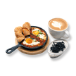 Bullseye Shakshuka breakfast combo with poached eggs in spiced tomato sauce served in a stone pan