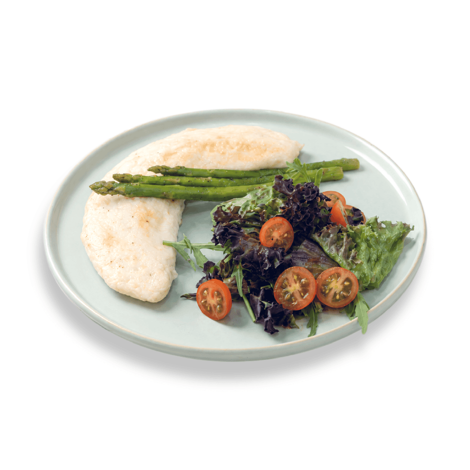 Nutritious egg white omelette folded over a mix of colorful garden-fresh vegetables and herbs