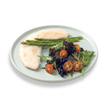 Nutritious egg white omelette folded over a mix of colorful garden-fresh vegetables and herbs