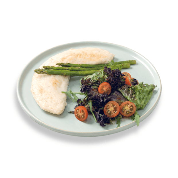 Nutritious egg white omelette folded over a mix of colorful garden-fresh vegetables and herbs