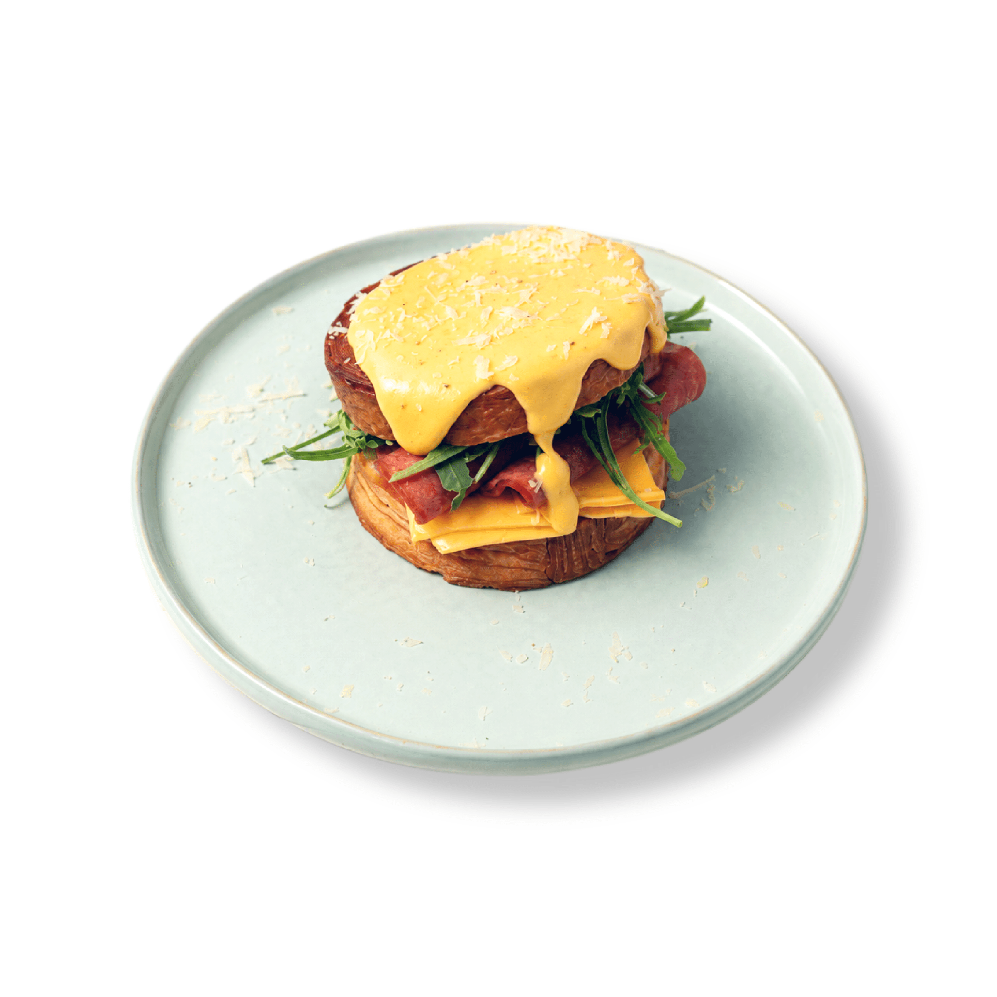 Flaky golden circular New York Roll croissant stuffed with premium ham and melted cheese