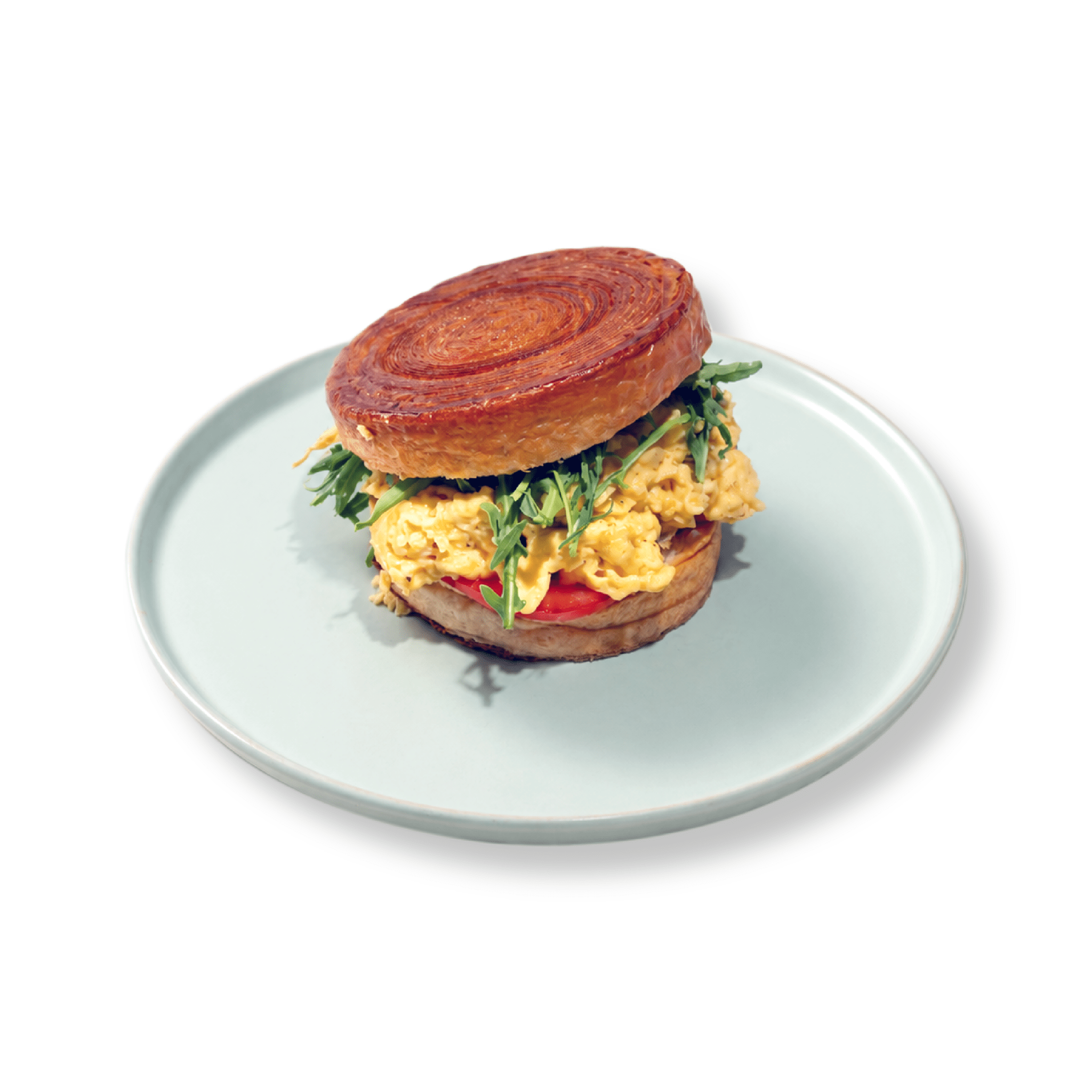 Flaky circular golden New York Roll croissant stuffed with warm fluffy scrambled eggs at BAEKRI Dubai