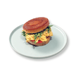 Flaky circular golden New York Roll croissant stuffed with warm fluffy scrambled eggs at BAEKRI Dubai