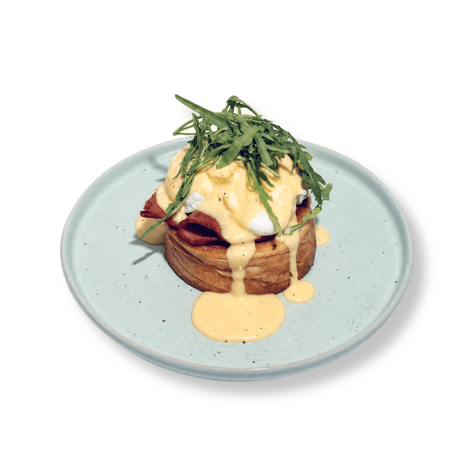 Gourmet Smoked Turkey Roll Eggs Benedict with perfectly poached eggs and rich velvety hollandaise sauce served